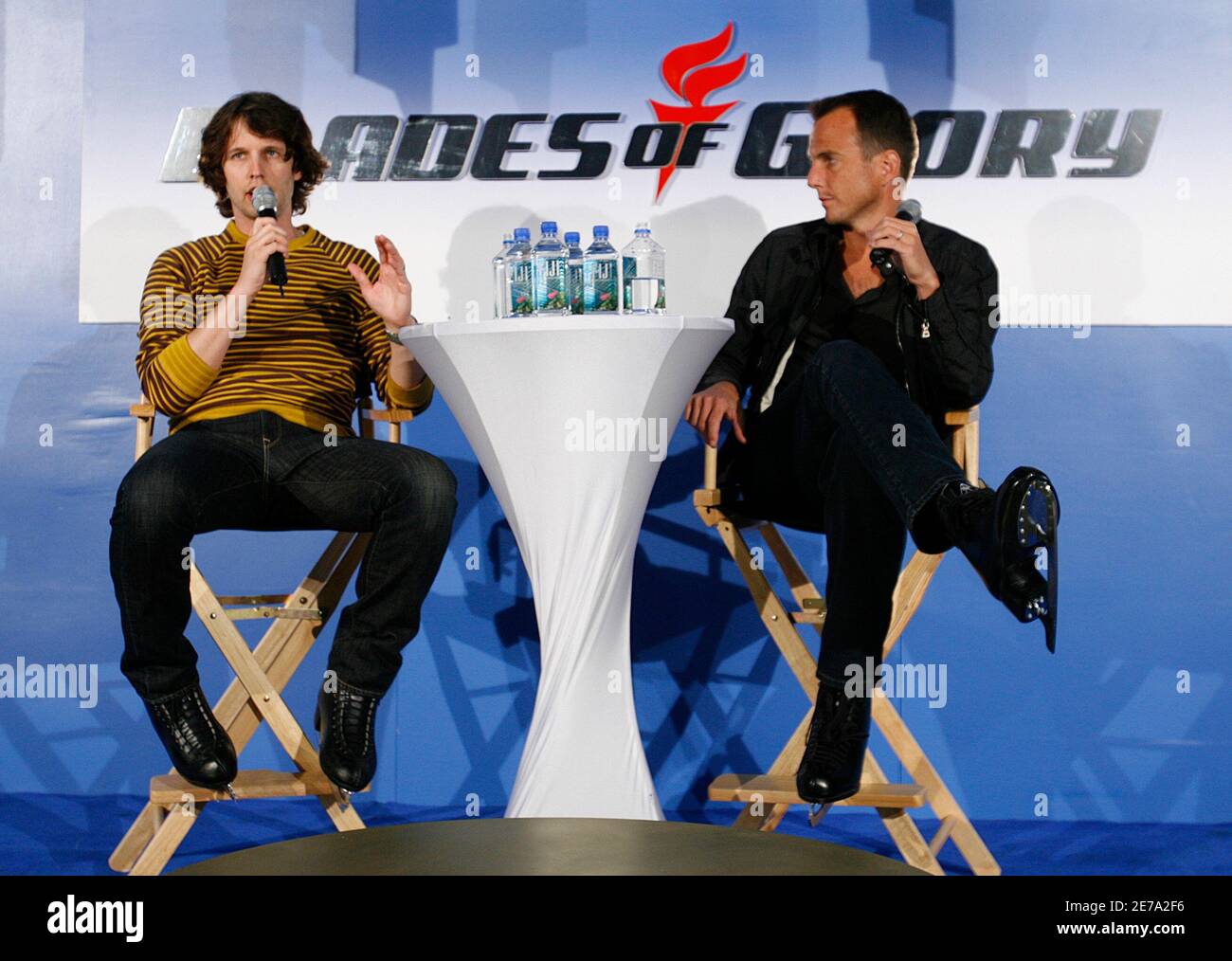 Actors Jon Heder (L) and Will Arnett talk during a media opportunity at an ice skating rink to promote their film "Blades of Glory" in Sydney June 6, 2007. REUTERS/Tim Wimborne (AUSTRALIA) Stock Photo