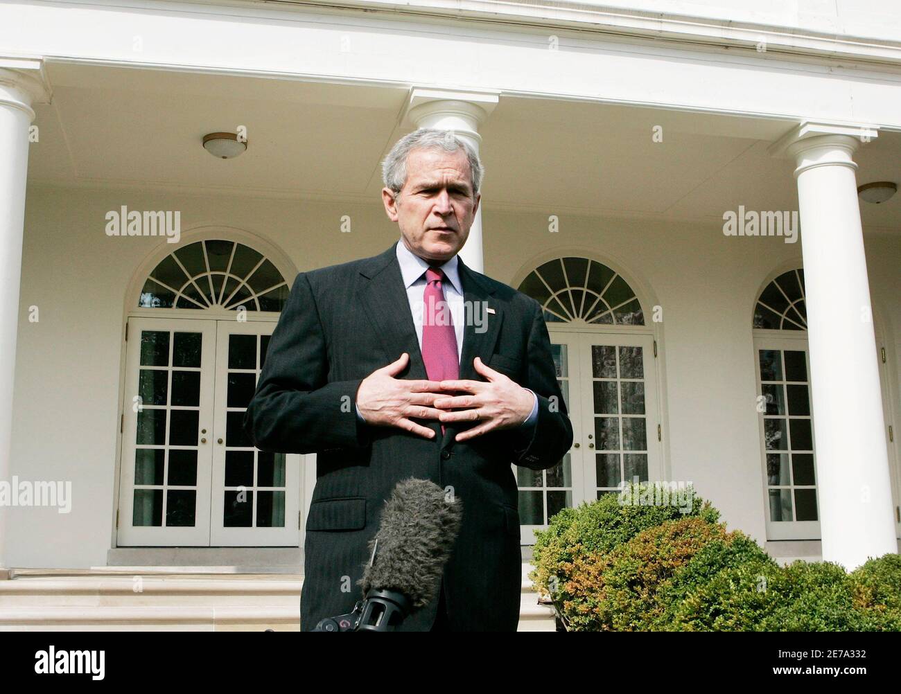 U.S. President George W. Bush talks about Press Secretary Tony Snow's phone call to him on Tuesday morning informing Bush of his reoccurring cancer, in the Rose Garden of the White House in Washington March 27, 2007.    REUTERS/Larry Downing (UNITED STATES) Stock Photo