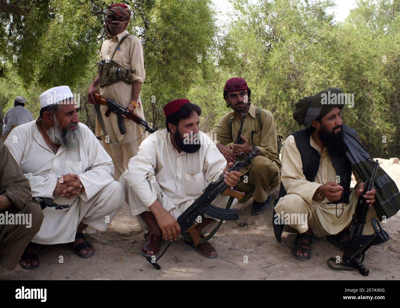 Men Hold Weapons While Attending The Funeral Of Commander Qari Zainuddin In Dera Ismail Khan Located In Pakistan S North West Frontier Province June 24 2009 A Gunman Working As A Guard Shot
