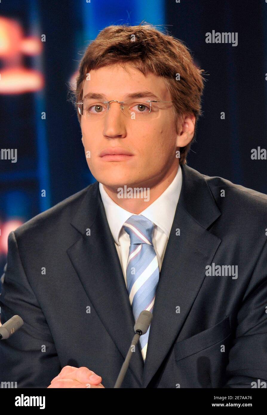 Jean Sarkozy, the 23-year-old son of French President Nicolas Sarkozy waits  for the start of France2 television evening news at their studios in  Boulogne-Billancourt to announce that has given up his bid
