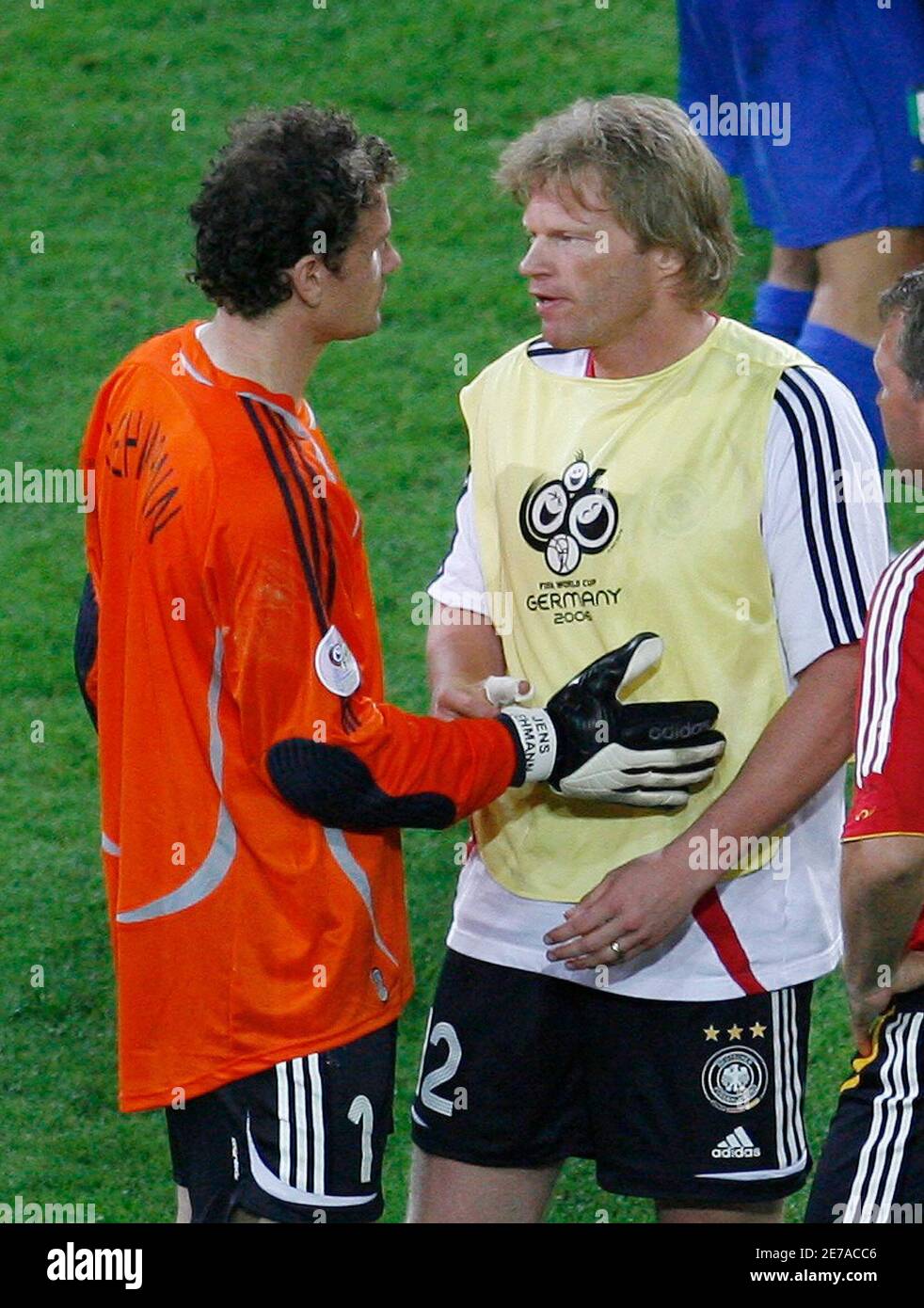Germany's Jens Lehmann (L) talks to team mate Oliver Kahn after their World  Cup 2006 semi-final soccer match against Italy in Dortmund July 4, 2006.  FIFA RESTRICTION - NO MOBILE USE REUTERS/Ina
