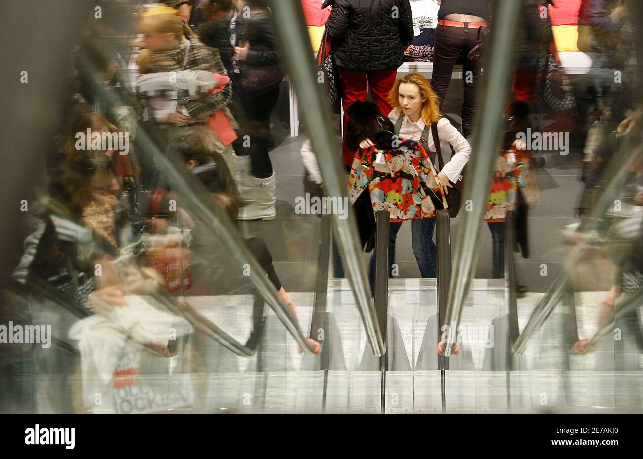 People shop in the newly opened Hennes & Mauritz (H&M) store in Moscow,  March 13, 2009. Swedish fashion giant H&M, the world's third-biggest  clothing retailer by sales after Gap Inc and Spanish