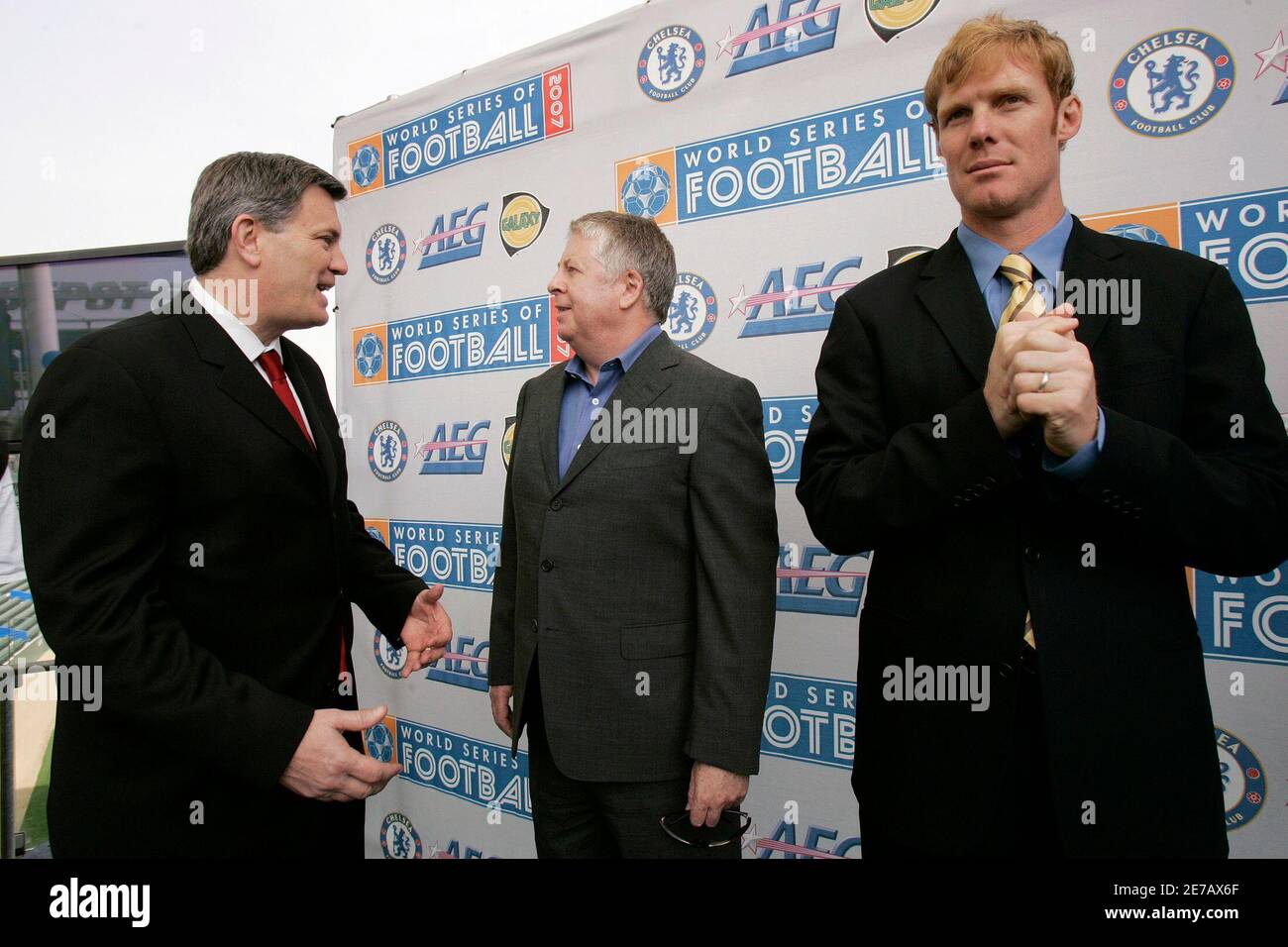 Paul Smith (C), director of business affairs for the Chelsea Football Club,  talks with AEG President Tim Leiweke (L) as Los Angeles Galaxy president  Alexi Kakas looks on following a news conference