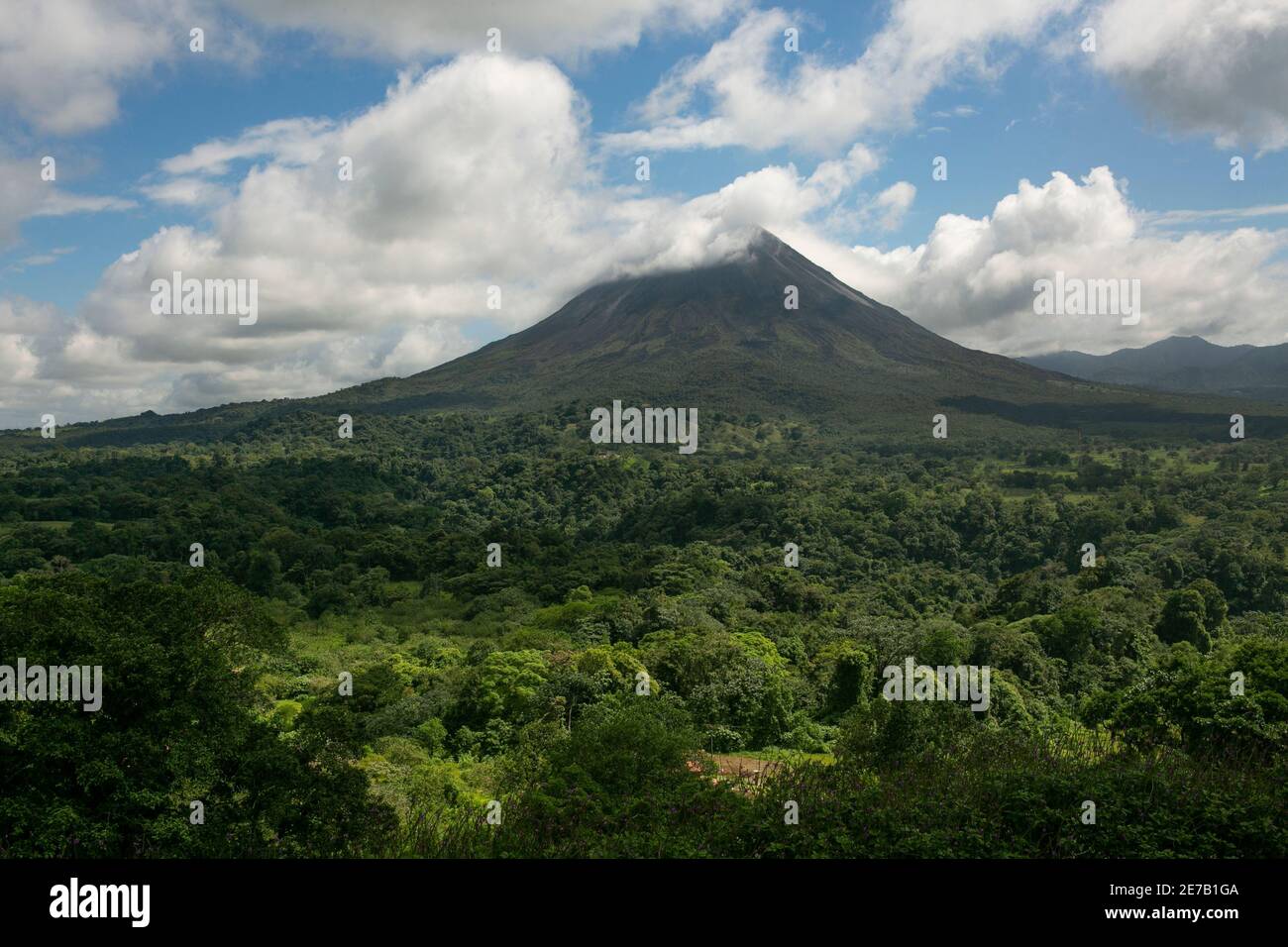 Arenal Volcano with clouds in Arenal National Park, La Fortuna Town of Costa Rica Stock Photo