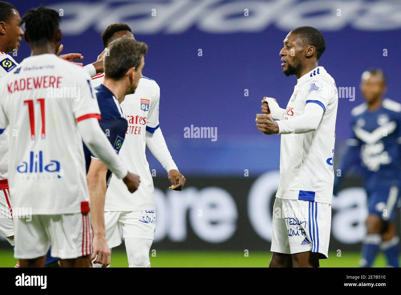 Olympique Lyonnais Karl Toko Ekambi celebrates scoring their first goal with teammates during Ligue 1 Olympique Lyon vs FC Girondins de Bordeaux football match at Groupama Stadium in Lyon France Janua...