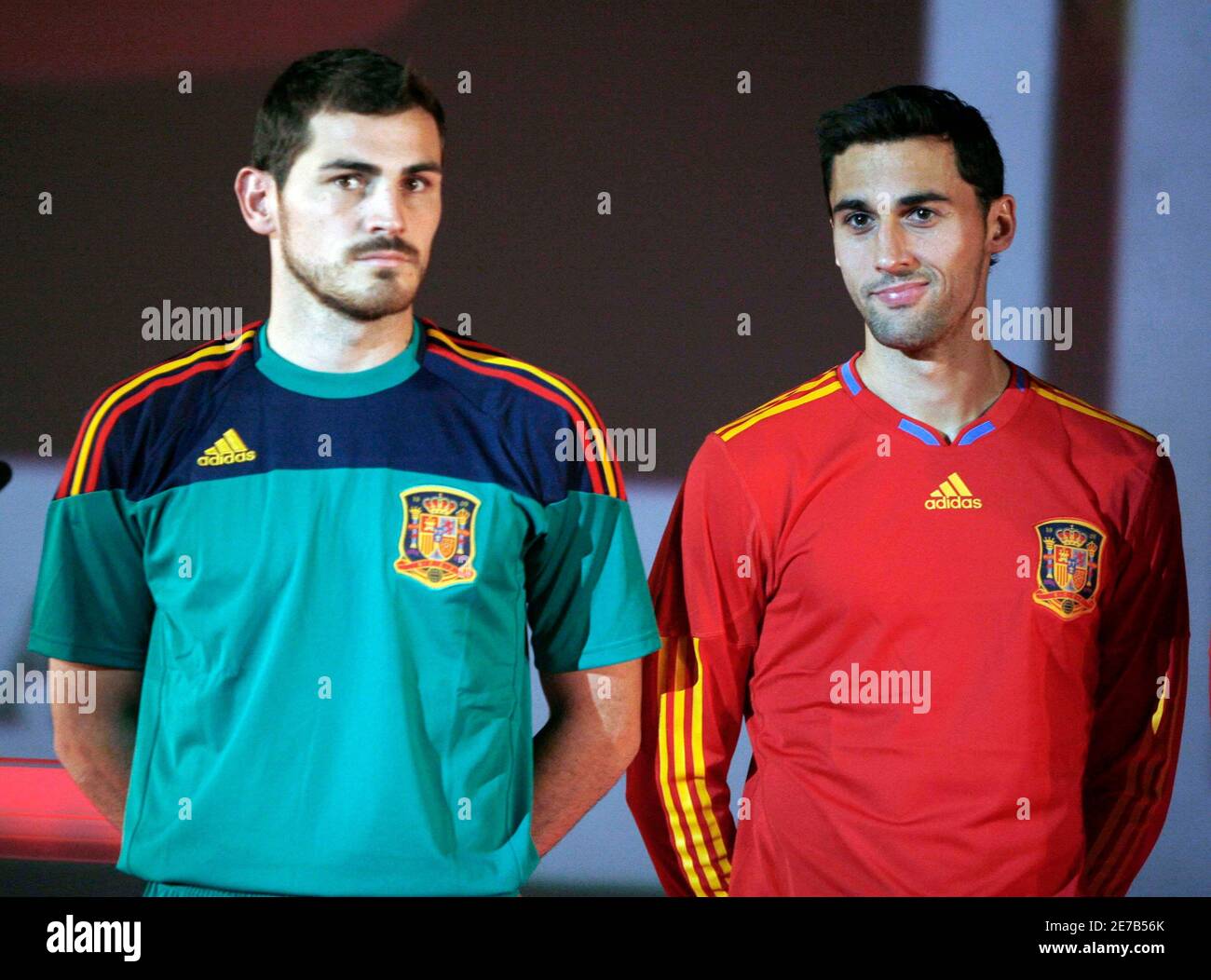 Spanish soccer players, goalkeeper Iker Casillas (L) and Alvaro Arbeola  present the new designer national soccer