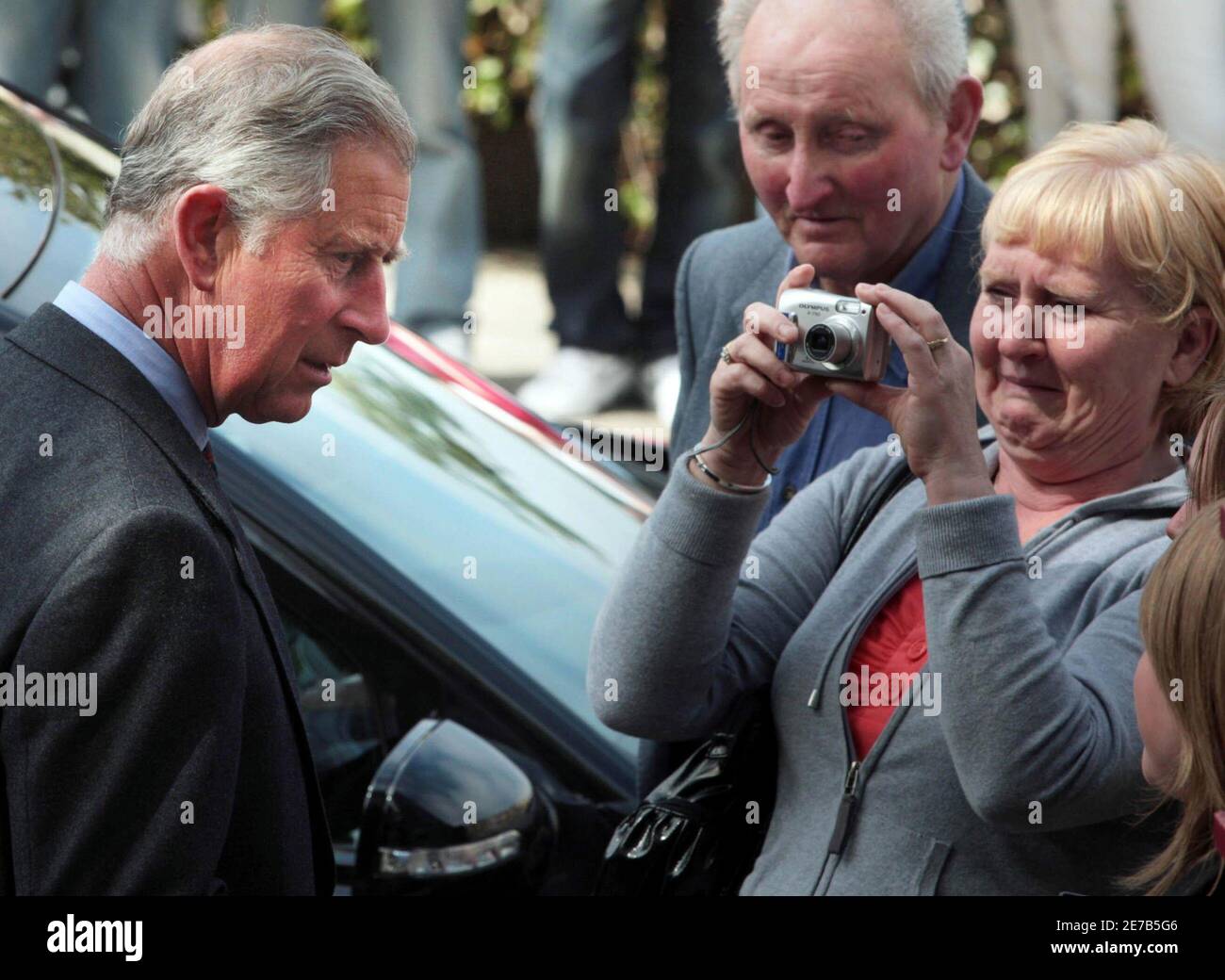 Britain's Prince Charles (L) talks to local residents outside The Orkney Traditional Music Project in Kirkwall during a visit to the island of Orkney, in Scotland June 1, 2009.    REUTERS/ David Cheskin/Pool   (BRITAIN ENTERTAINMENT ROYALS SOCIETY) Stock Photo