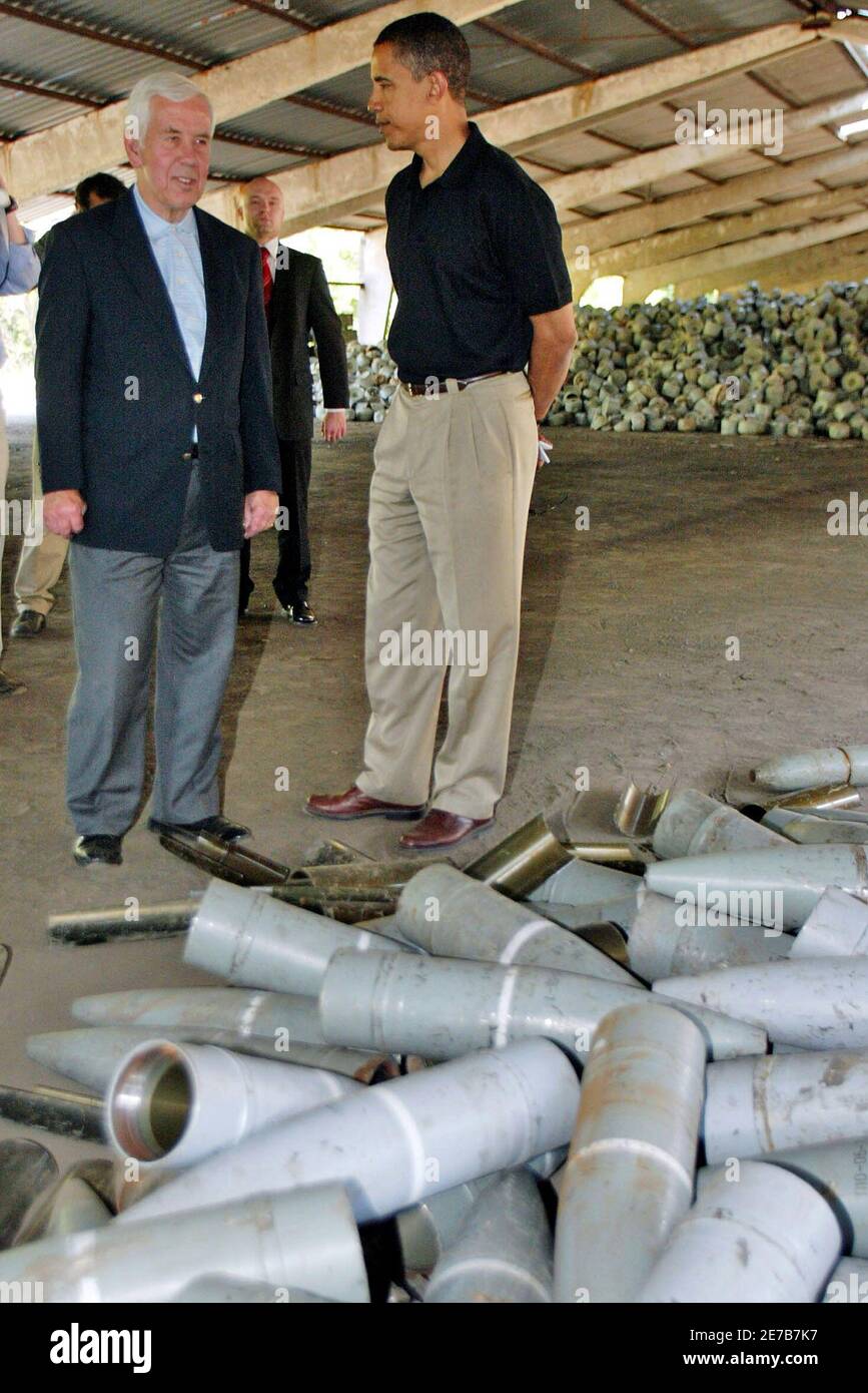 U.S. Senator Richard Lugar, Head of the Senate Foreign Relations Committee (L) and Senator Barack Obama inspect a pile of decommissioned weapons in a warehouse in Donetsk August 30, 2005. Obama and his colleague Senator Richard Lugar visit Ukraine to oversee destruction of dangerous material from the Soviet era and announced the signature of an agreement providing for U.S. funds to help Ukraine deal with and destroy its chemical weapons. REUTERS/Alexander Khudotioply TP/CVI Stock Photo