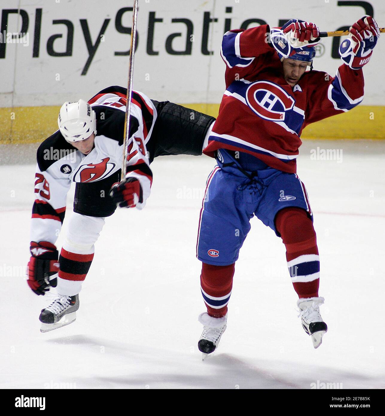 Montreal Canadiens' Alexei Kovalev (R) and New Jersey Devils' Grant  Marshall collide during the second period of their NHL game in Montreal,  April 8, 2006. REUTERS/Christinne Muschi Stock Photo - Alamy
