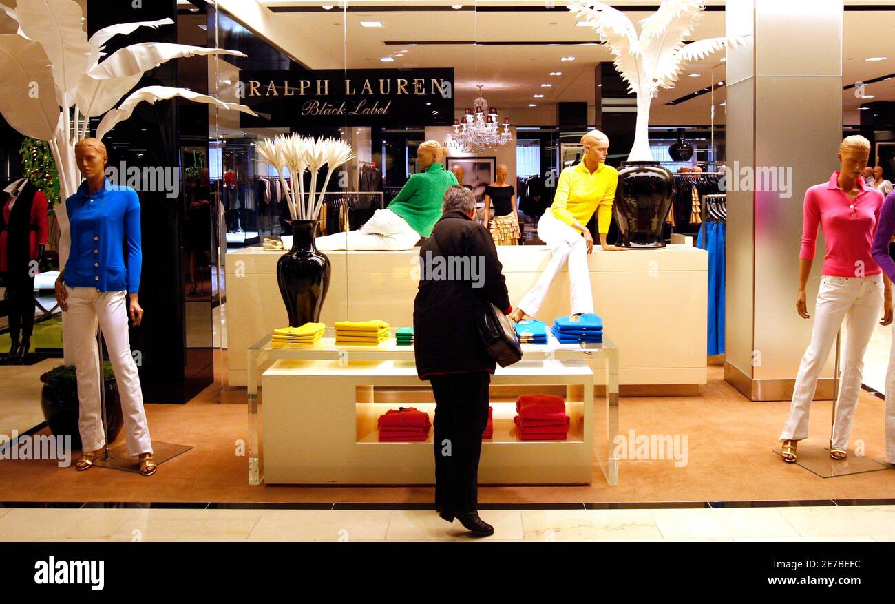 A shopper looks at goods by designer Ralph Lauren at a display in  Bloomingdales department store in New York, November 19, 2008. U.S. retail  stores may be much less crowded this holiday