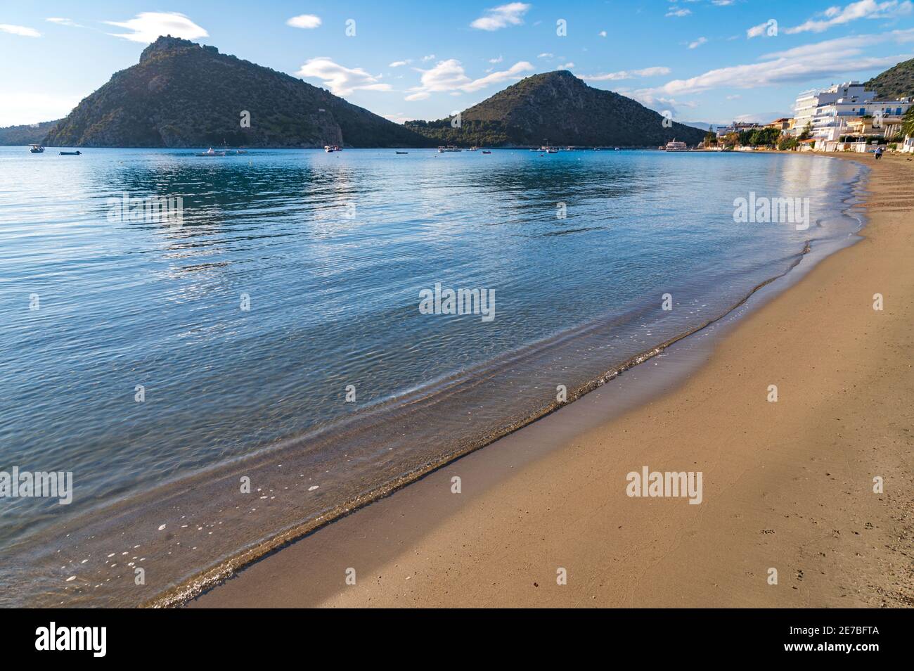 Sand beach at the seaside resort of Tolo, Greece Stock Photo