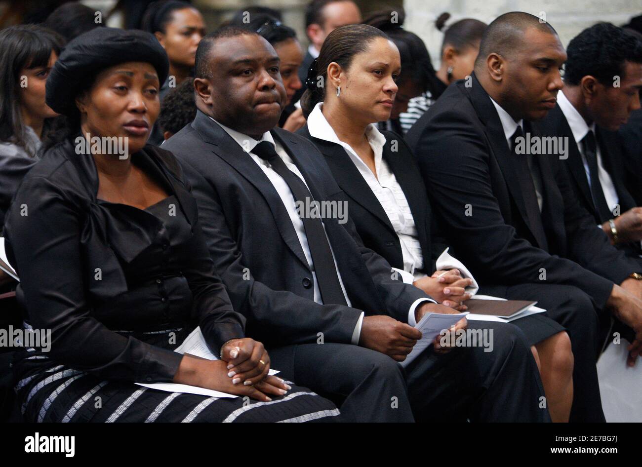 Jean-Pierre Bemba (2ndL), former Congolese rebel warlord standing trial on  charges of war crimes, and relatives attend a memorial service for his  father Jeannot Bemba Saolona at Brussels' Sint-Gudule Cathedral, July 8,