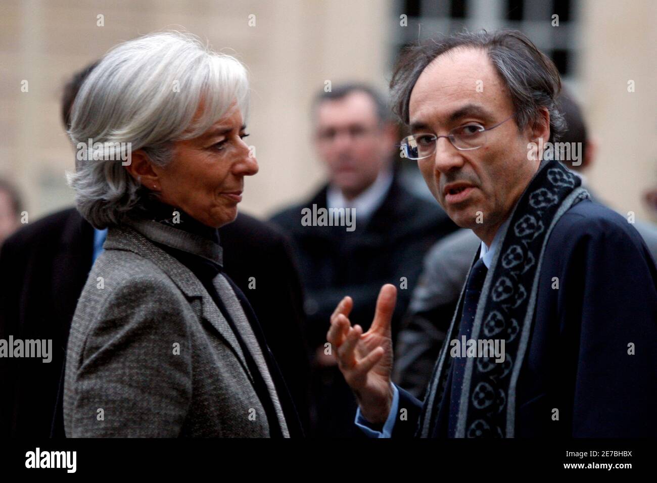 France's Economy Minister Christine Lagarde (L) speaks with Bernard Spitz,  French head of the FFSA (French federation of Insurance Companies) after a  meeting about the storm with high winds which hit southwestern