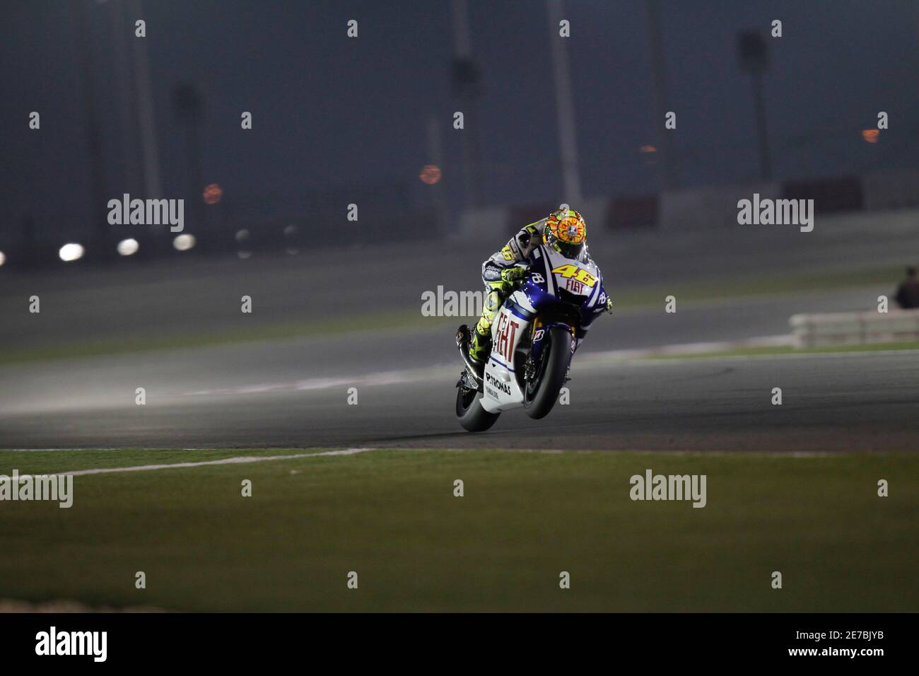 Fiat Yamaha MotoGP rider Valentino Rossi of Italy rides during a free  practice session at the MotoGP World Championship at the Losail  international circuit in Doha April 9, 2010. REUTERS/Fadi Al-Assaad (QATAR)