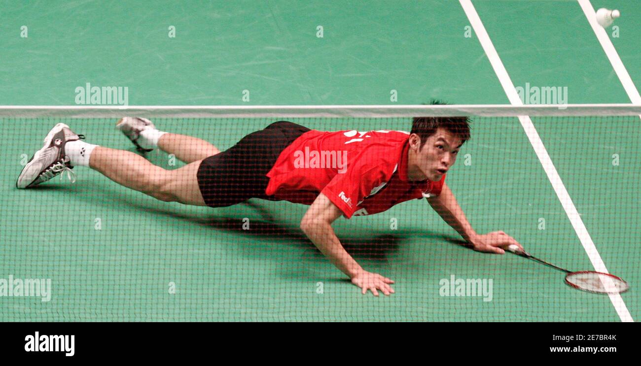 China's Lin Dan dives as he returns a shot to China's Bao Chunlai during  the men's singles semi-finals at the All England badminton championships in  Birmingham, England March 10, 2007. REUTERS/Alessia Pierdomenico (