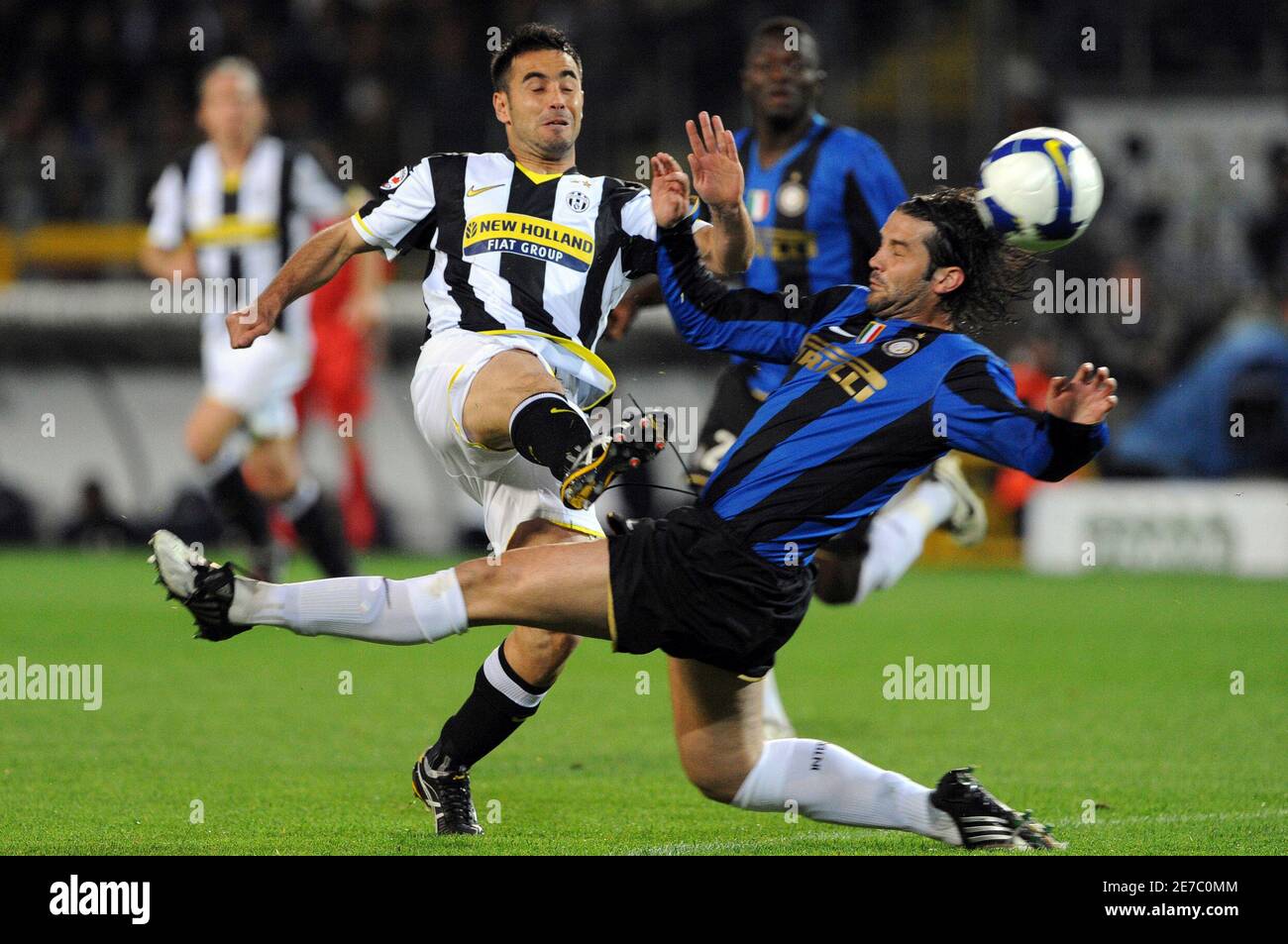 Juventus' Marco Marchionni (L) challenges Christian Chivu of Inter Milan during their Serie A soccer match at the Olympic stadium in Turin April 18, 2009. REUTERSAlessandro Bianchi   (ITALY SPORT SOCCER) Stock Photo