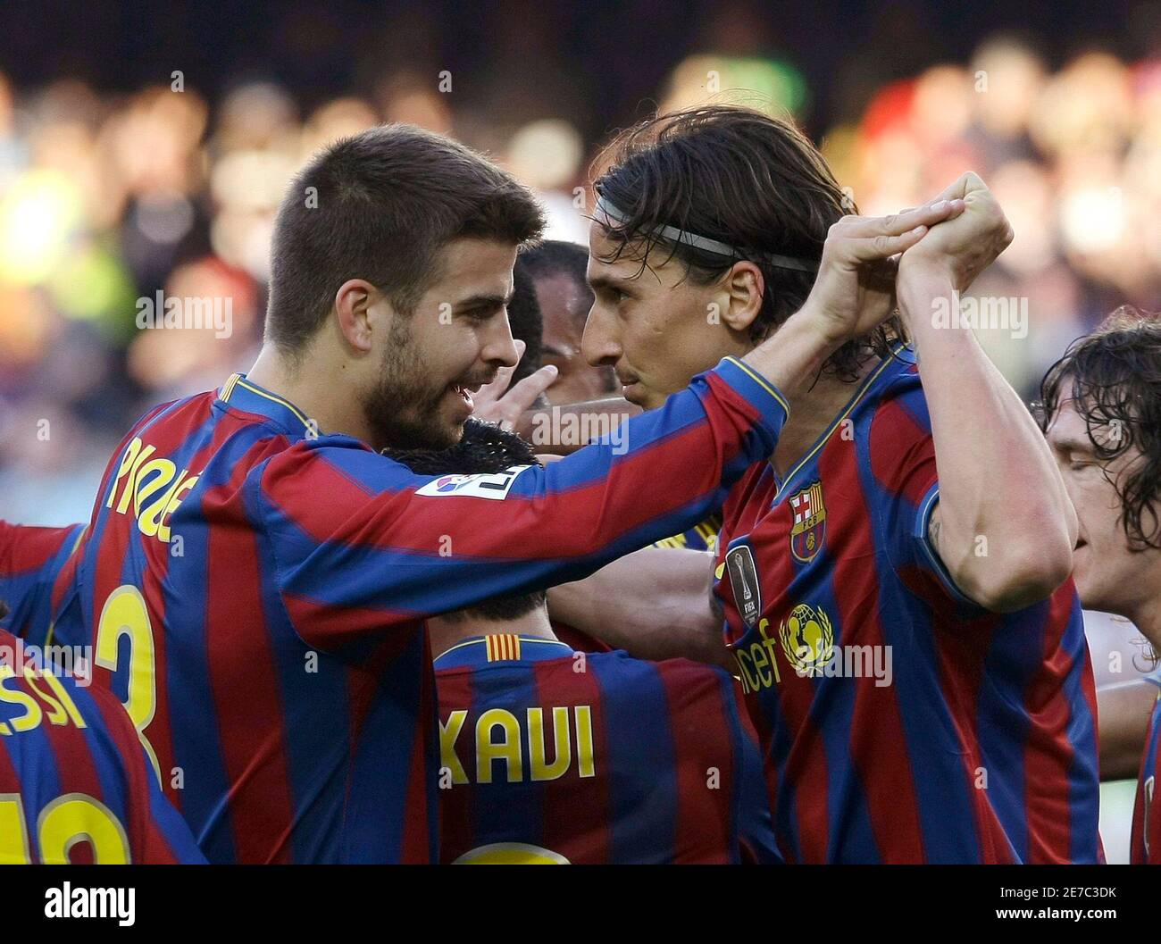 Barcelona's Zlatan Ibrahimovic (R) celebrates his goal with teammate Gerard  Pique during their Spanish first division soccer match against Xerez CD at  the Nou Camp stadium in Barcelona, April 24, 2010. REUTERS/Gustau