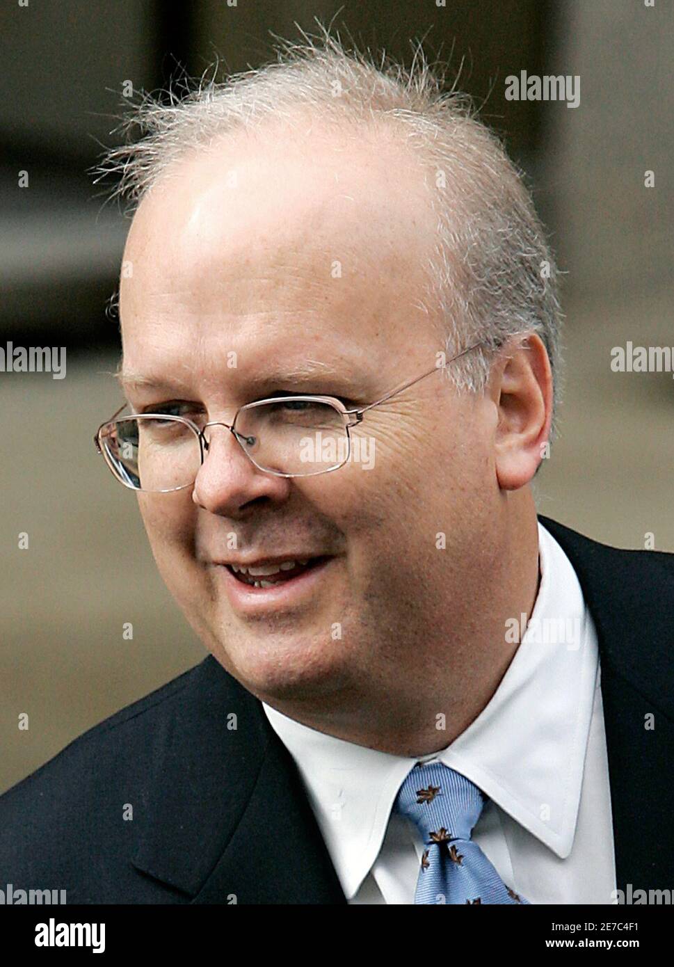 White House political advisor Karl Rove smiles as he departs the U.S. Federal Courthouse after testifying for the fourth time before a federal grand jury investigating the CIA leak case in Washington, October 14, 2005. Rove, the most powerful and controversial political strategist in Washington, had no comment as he entered the federal courthouse on Friday morning to begin his testimony, hoping to convince grand jurors he did nothing illegal. He also declined to comment when he left 4-1/2 hours later, mouthing to reporters: 'Not supposed to take questions. Stock Photo