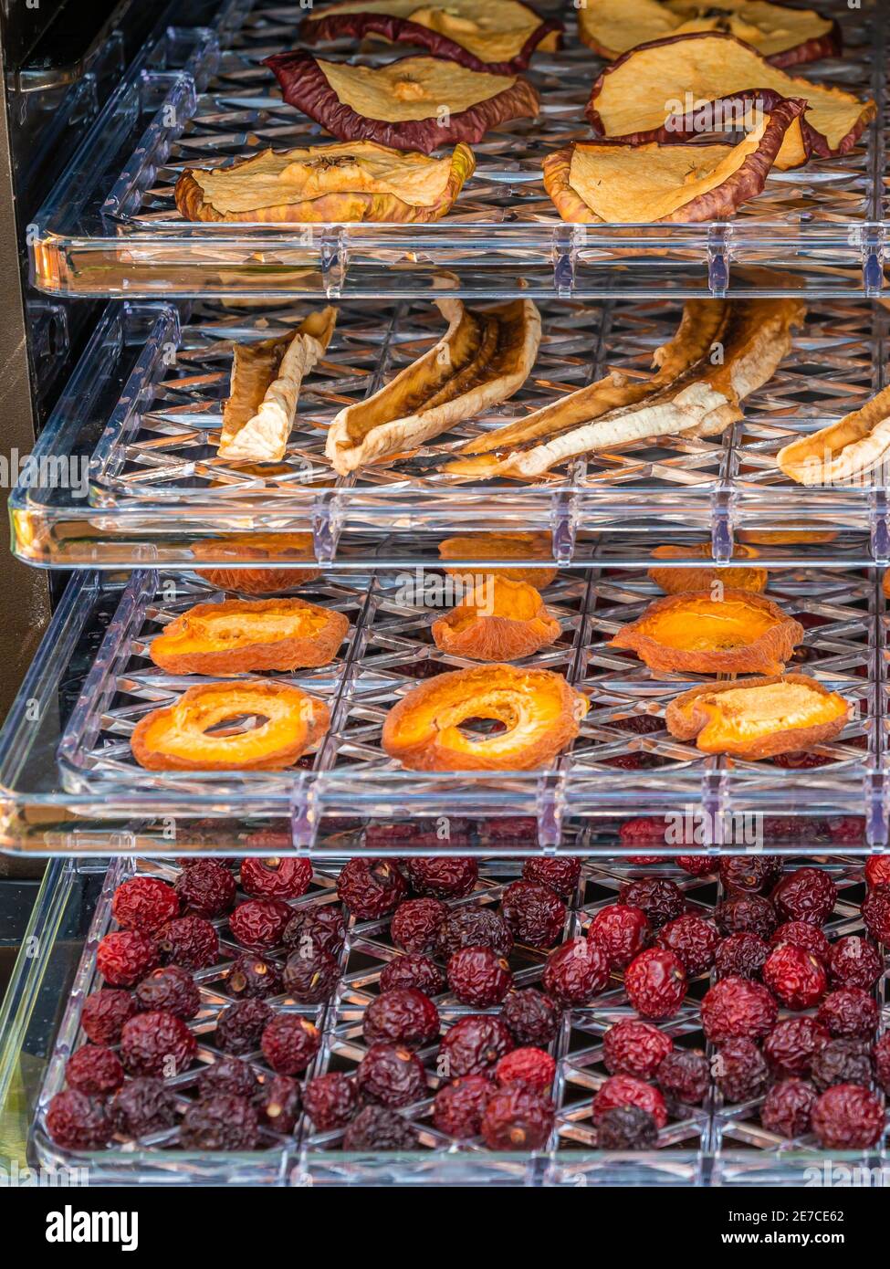 Dried fruitsapples, bananas, apricots and cherries on plastic pallets