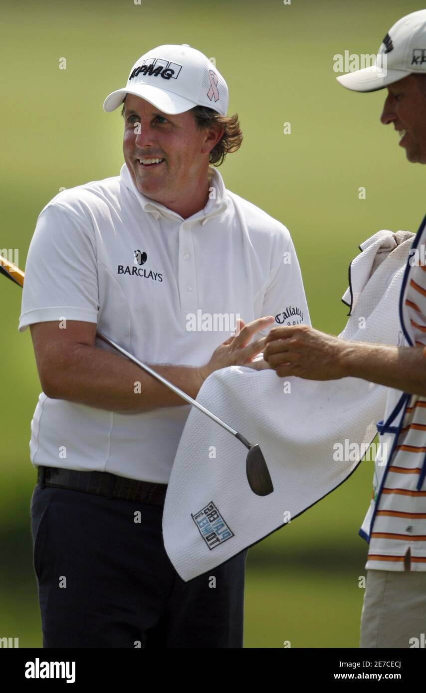 Phil Mickelson of the United States prepares for his putt on the ninth green during the third round of the St. Jude Classic golf tournament at TPC Southwind in Memphis, Tennessee, June 13, 2009.   REUTERS/Nikki Boertman    (UNITED STATES SPORT GOLF) Stock Photo