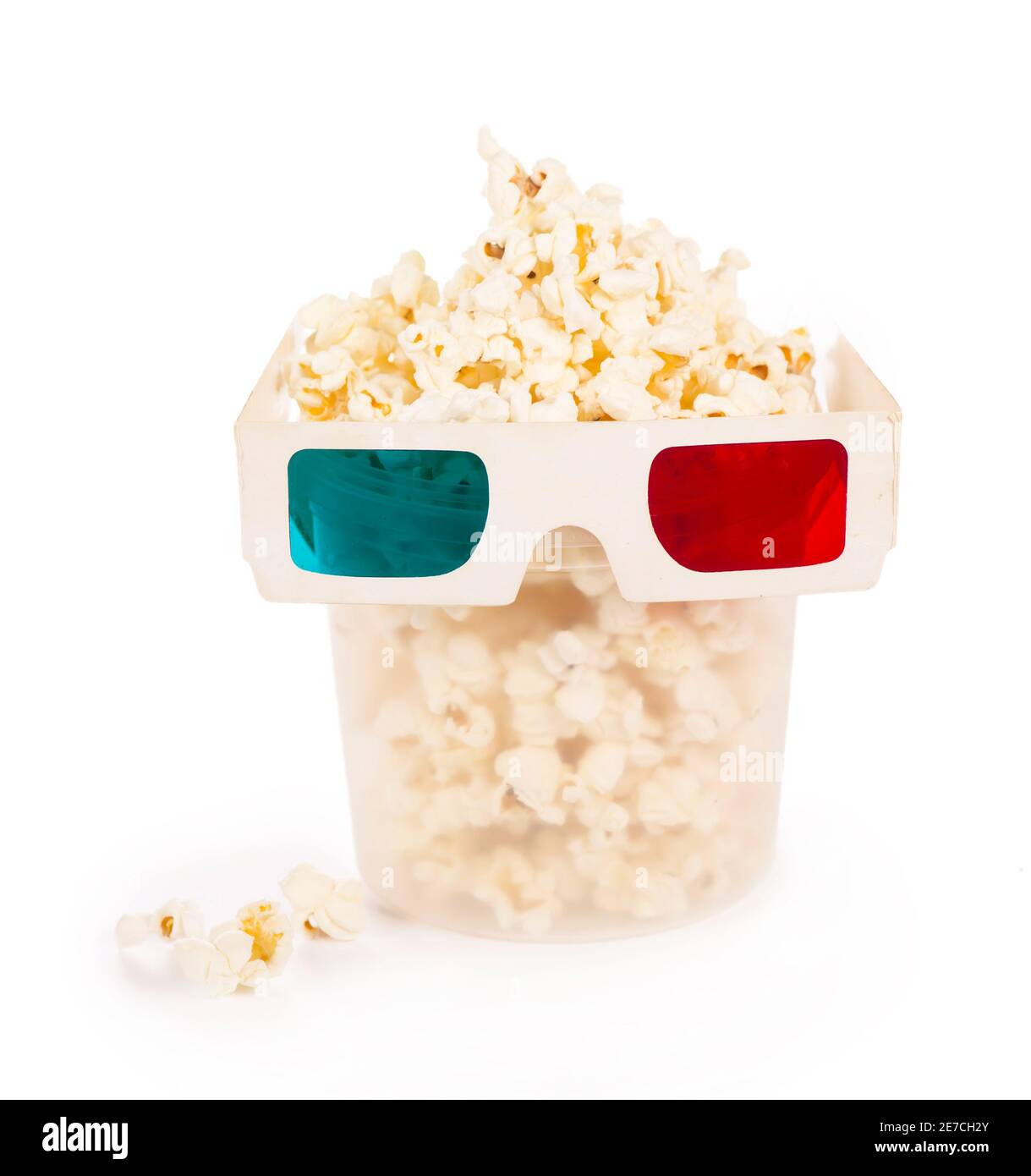 Paper striped bucket with popcorn and 3D glasses isolated on white background with clipping path. Stock Photo