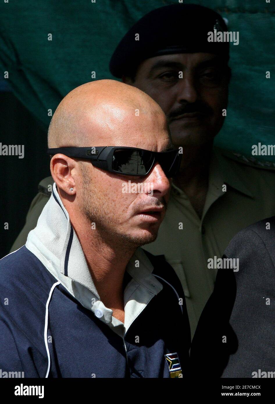 South African batsman Herschelle Gibbs (front) arrives at the police  headquarters in New Delhi October 12, 2006. Gibbs will be questioned by  Indian police on Thursday over a six-year-old match-fixing case ahead