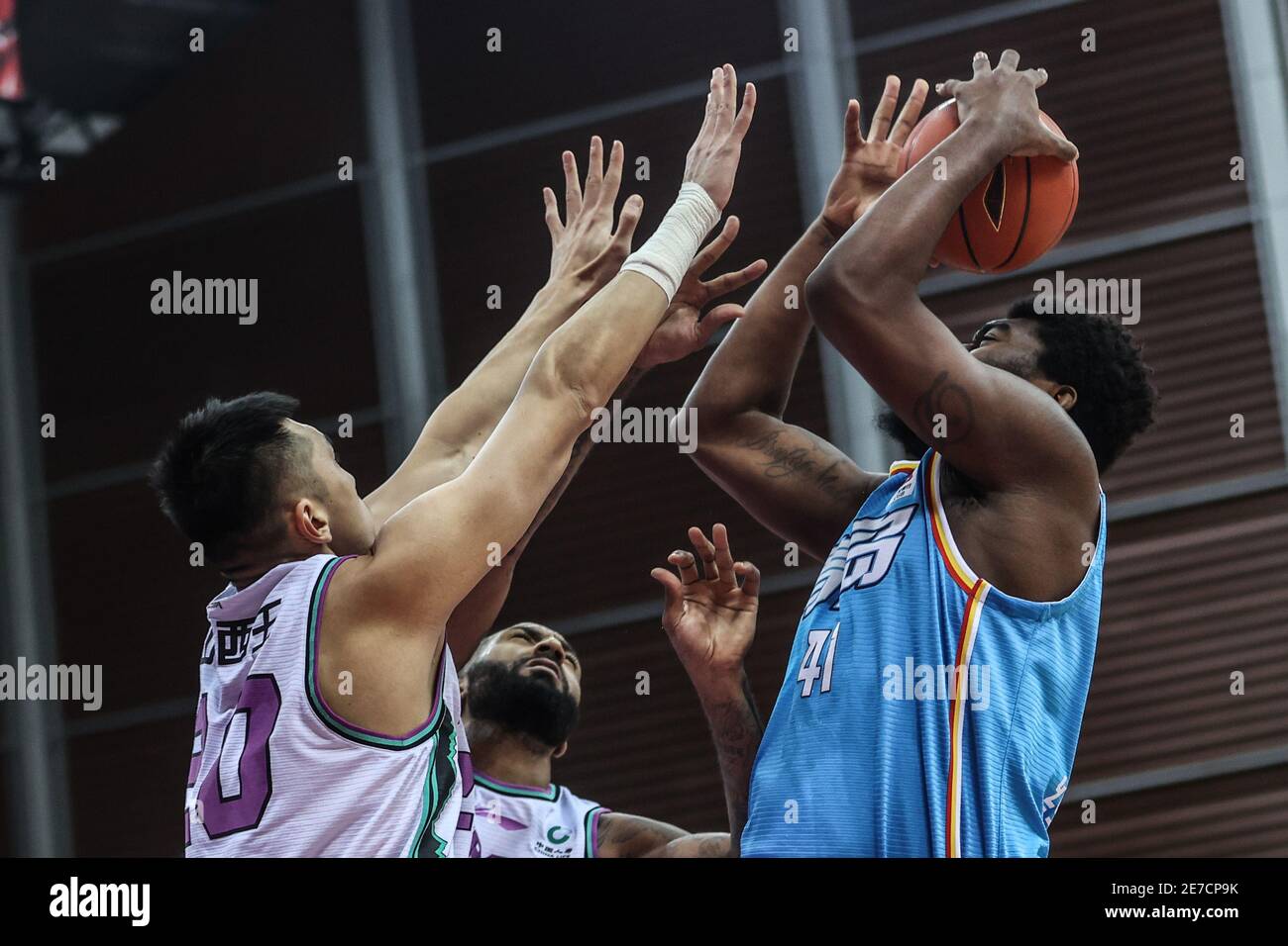 Zhuji, China's Zhejiang Province. 30th Jan, 2021. Dakari Johnson (R) of
