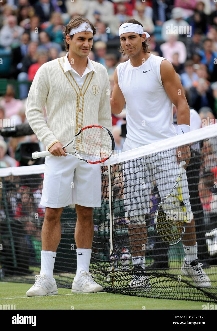 Roger Federer of Switzerland and Rafael Nadal of Spain pose for a  photograph on centre court before their finals match at the Wimbledon  tennis championships in London July 6, 2008. REUTERS/Toby Melville (