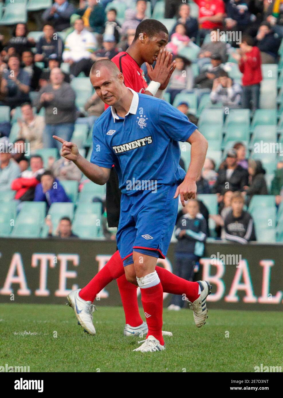 Kenny Miller (front) of Glasgow Rangers FC celebrates scoring against Blackburn Rovers FC during their soccer match as part of the Sydney 2010 Festival of Football at Sydney Football Stadium July 25, 2010.  REUTERS/Daniel Munoz (AUSTRALIA - Tags: SPORT SOCCER) Stock Photo