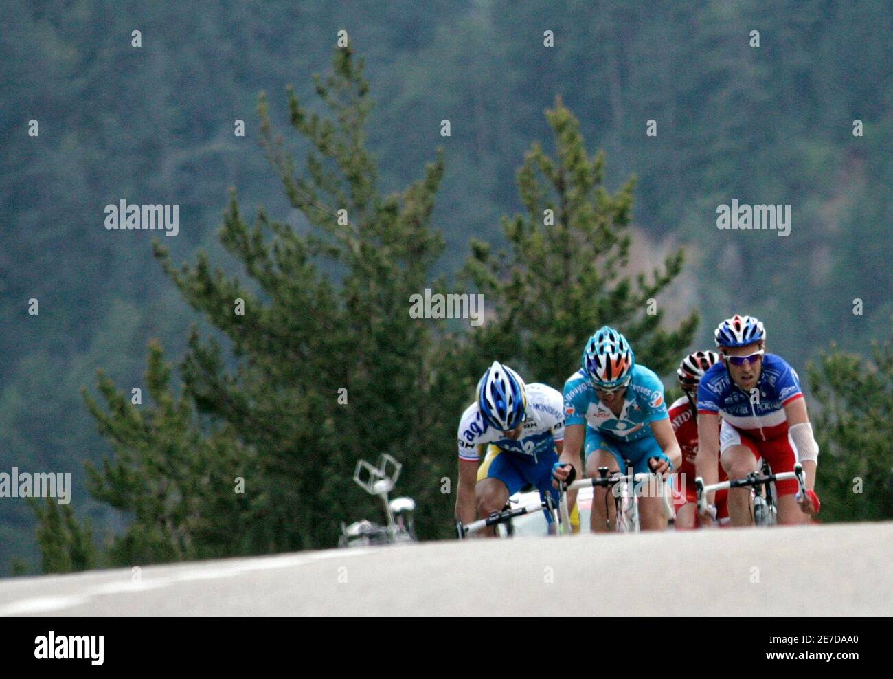 France's Cyril Dessel, of the AG2R-La Mondiale team (L) rides near Team Milram's Dominik Roels of Germany and Agritubel's Cristophe Moreu (R) of France during the third stage of the Tour of Catalonia cycling race from Banyoles to La Seu D'urgell, May 21, 2008.   REUTERS/Gustau Nacarino  (SPAIN) Stock Photo