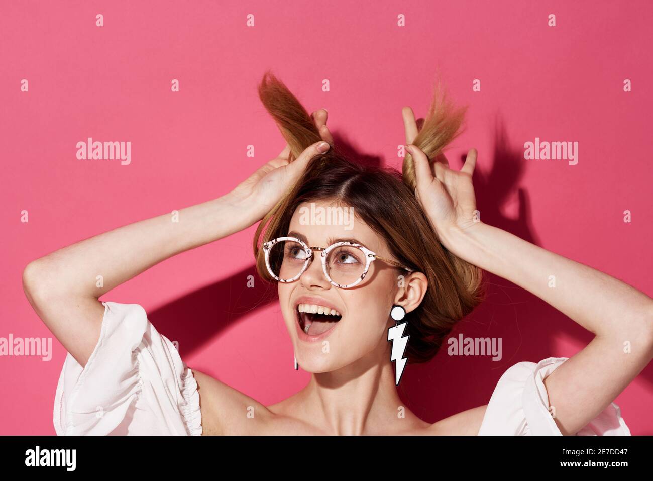 Cheerful pretty woman earrings jewelry attractive look fashion pink