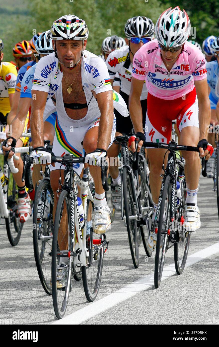 Italy's Giovanni Visconti (R), wearing the leader's pink jersey, cycles near his compatriot world champion Paolo Bettini during the seventh stage of the 176-km Giro d'Italia cycling race from Vasto to Pescocostanzo May 16, 2008.  REUTERS/Giampiero Sposito (ITALY) Stock Photo