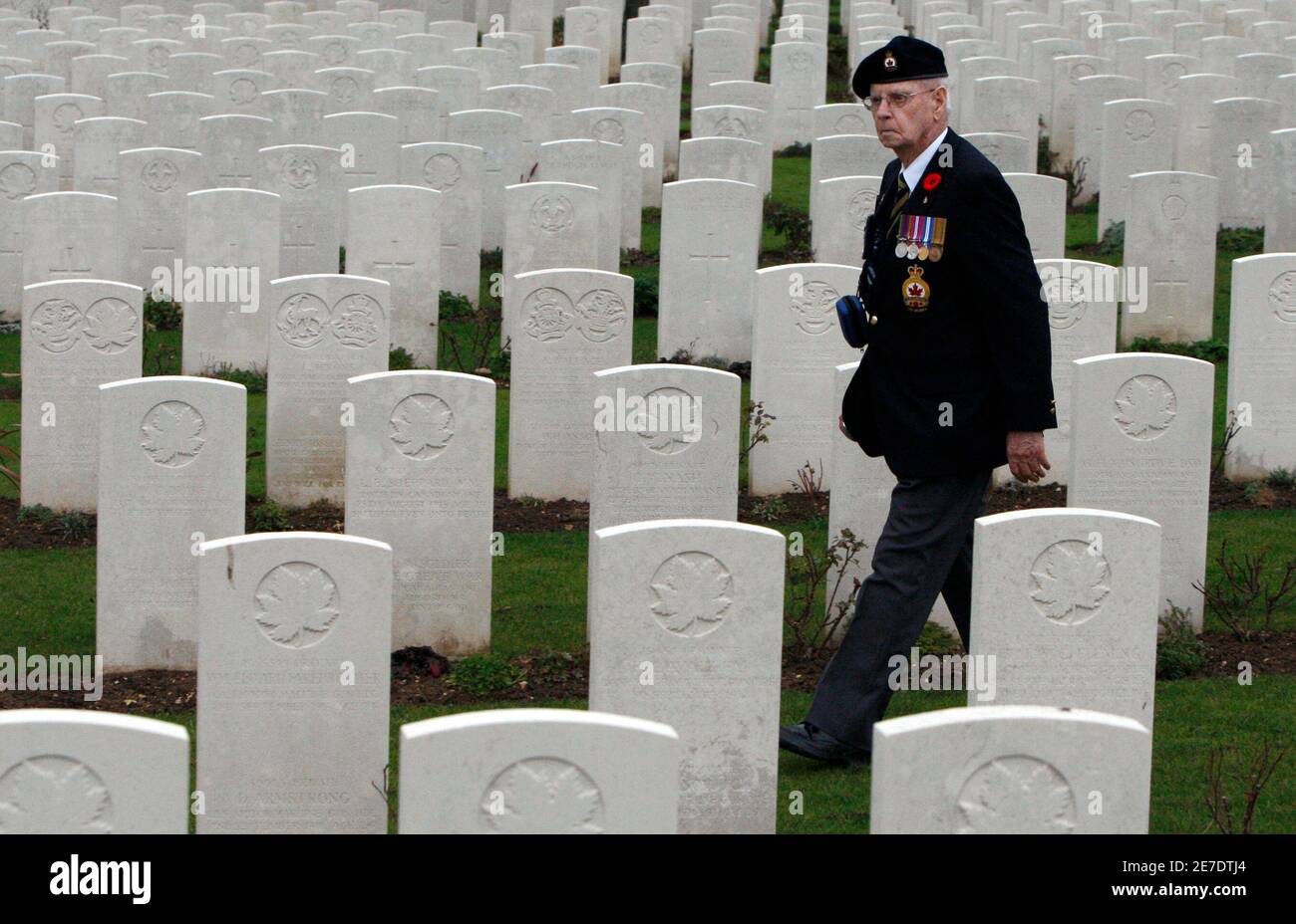 Canadian Second World War veteran John Henderson, of Carnduff, Saskatchewan, tours the Vis-en-Artois British Cemetery in Vis-en-Artois, France November 10, 2008. A group of Canadian veterans is travelling through France and Belgium to commemorate the 90th anniversary of the end of the First World War.       REUTERS/Chris Wattie       (FRANCE) Stock Photo