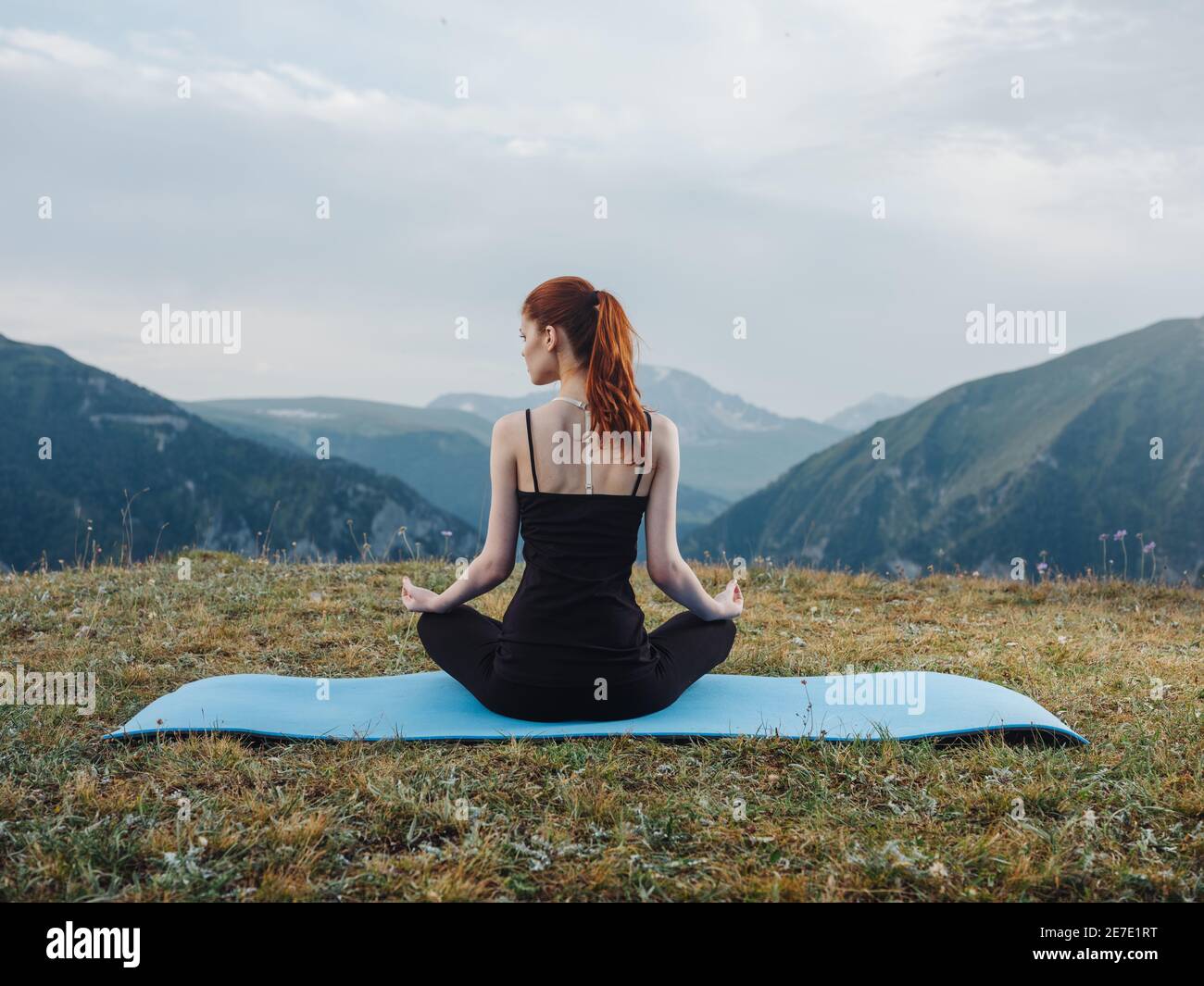 Woman sitting on a mat meditation yoga asana nature fresh air Stock ...