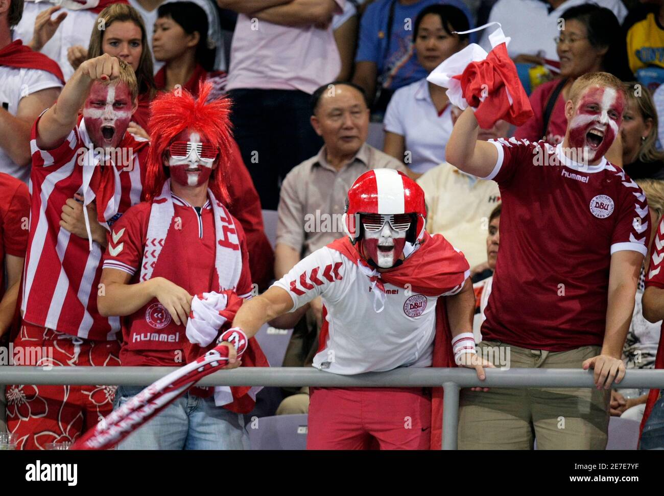 Denmark fans cheer their team during their Group B men's handball game against South Korea at the Beijing 2008 Olympic Games August 12, 2008. REUTERS/Sergio Moraes (CHINA) Stock Photo