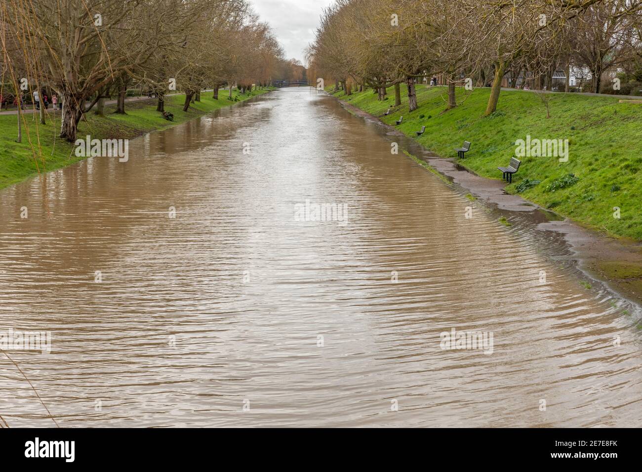 The Royal Military Canal, Hythe, Kent flooding over the footpath Stock