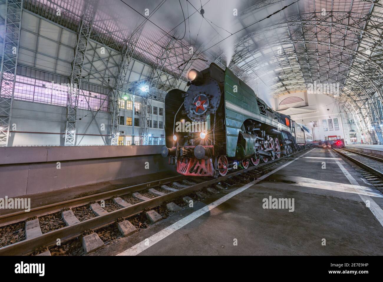 Moscow, Russia - January 30, 2021: Retro steam train stands by the passenger platform. Stock Photo