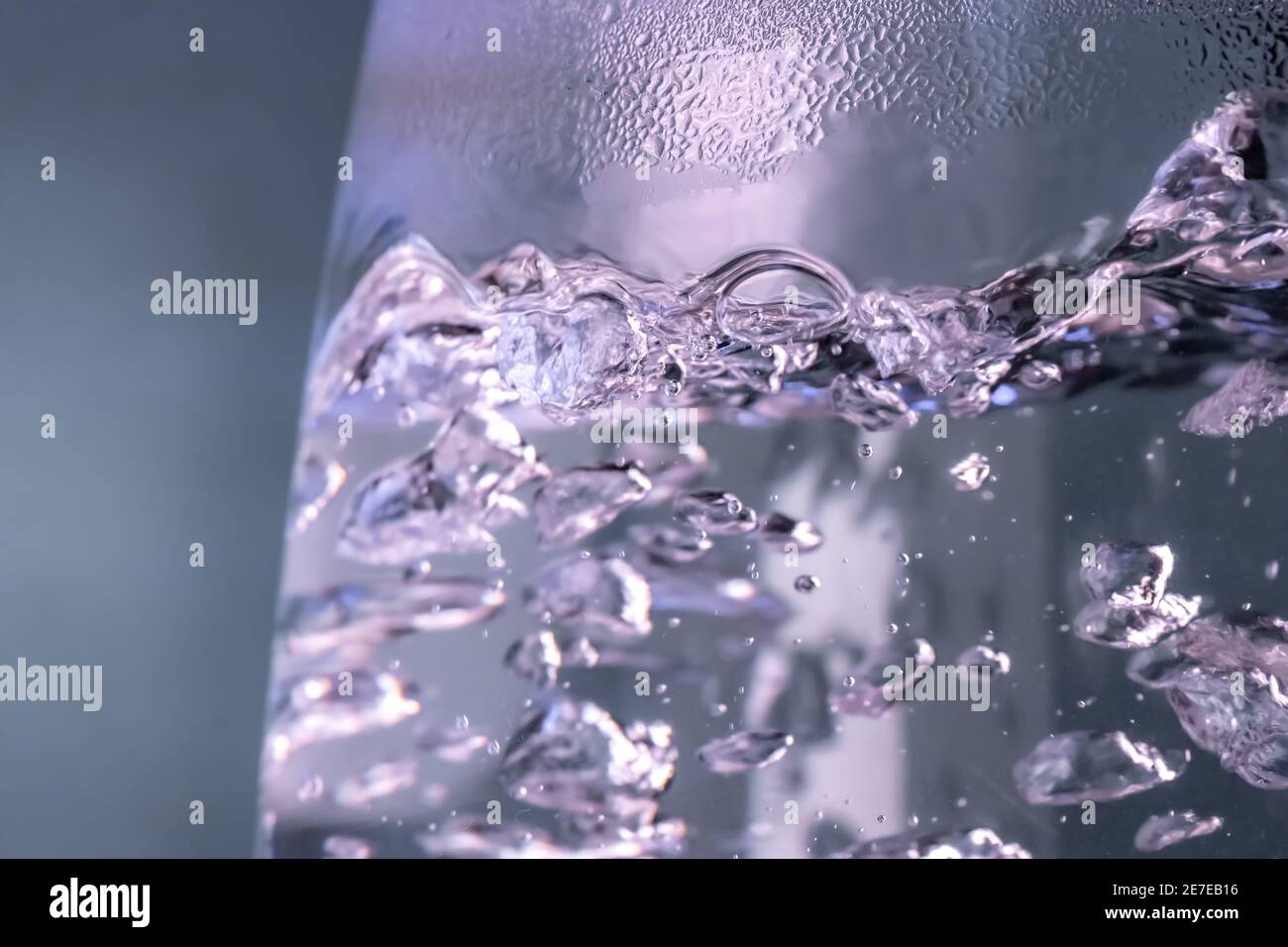 A water is boiled in an electric kettle with transparent walls, close