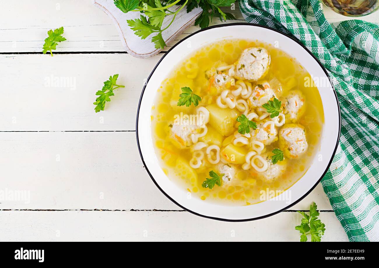 Healthy chicken meatballs soup and pasta. Simple recipe for cooking at home. Top view, flat lay