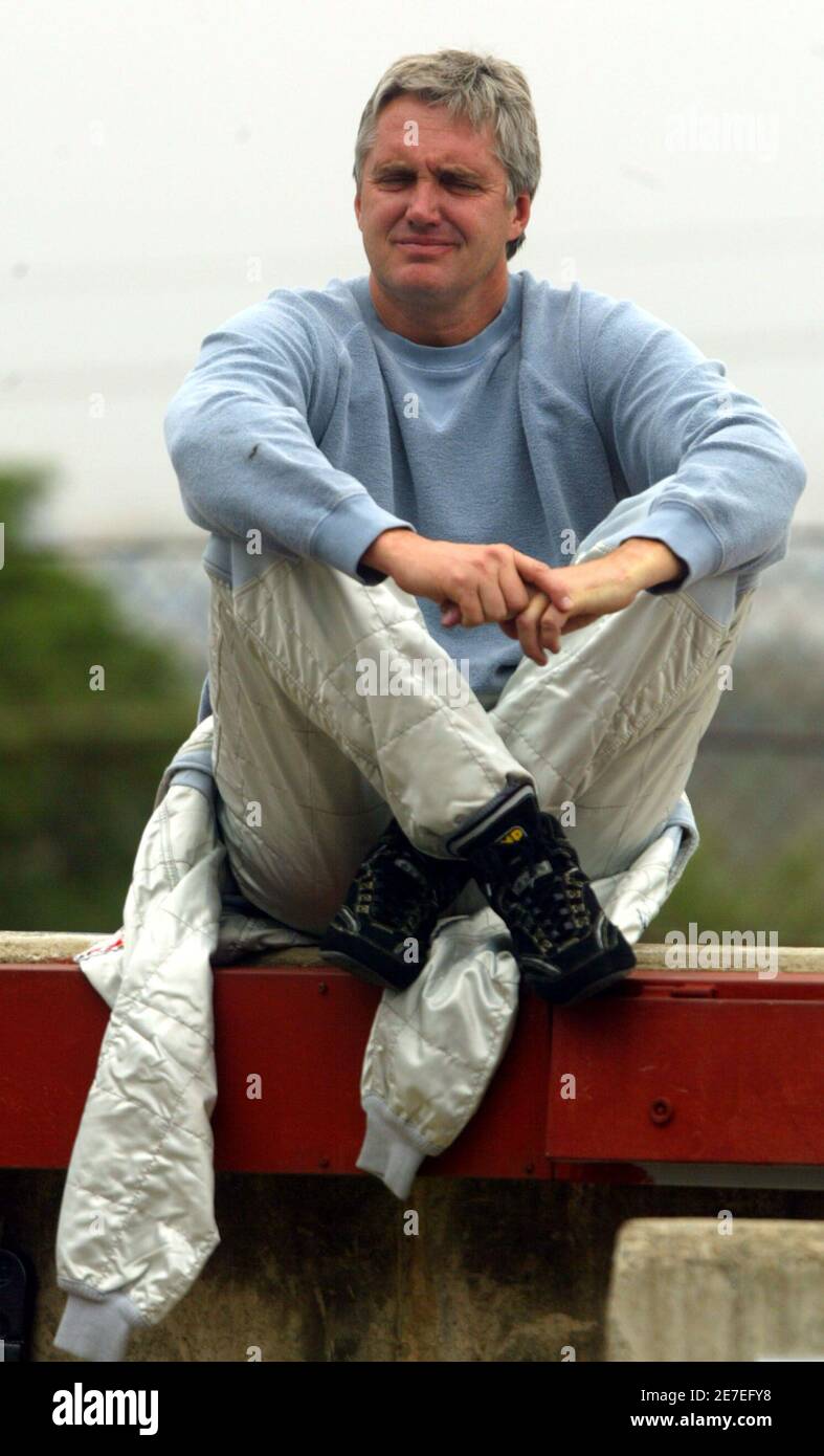 Eddie Cheever of the U.S. relaxes in the pit before riding his Altech car during their free practice session at the Kyalami in Johannesburg November 11, 2005. The Grand Prix race will be held on Sunday. REUTERS Juda Ngwenya Stock Photo