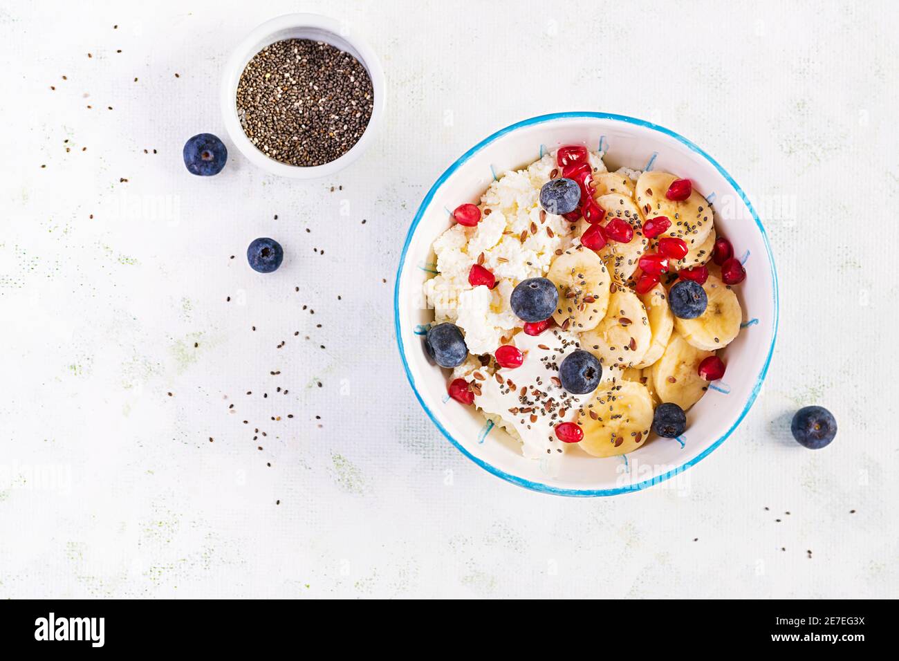 Cottage cheese with bananas, blueberries. Dietary breakfast for