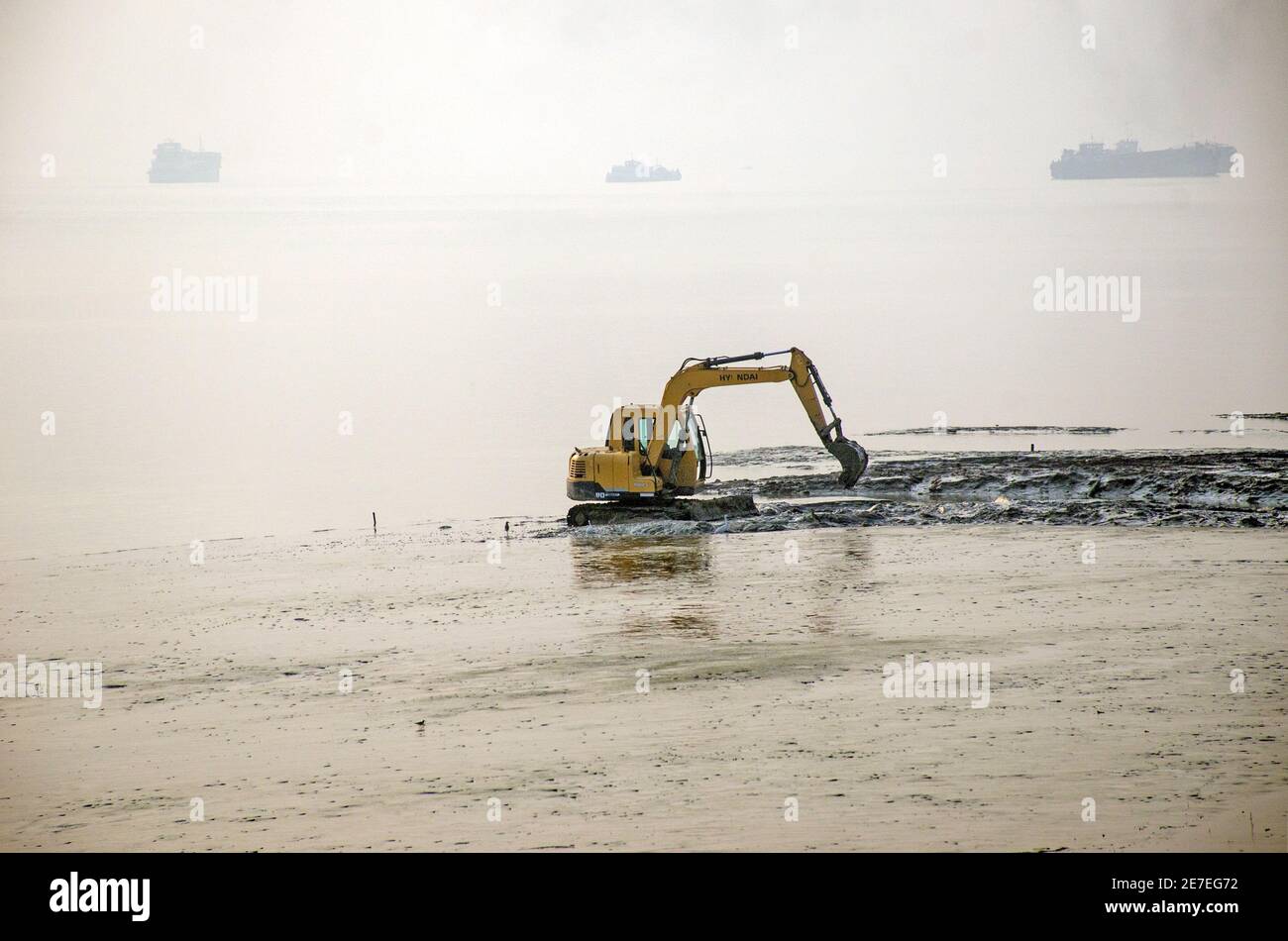 diamond harbour west bengal india on 13th december 2020:Diamond Harbor's Ganges River is being dredged to increase river navigability during low tide. Stock Photo