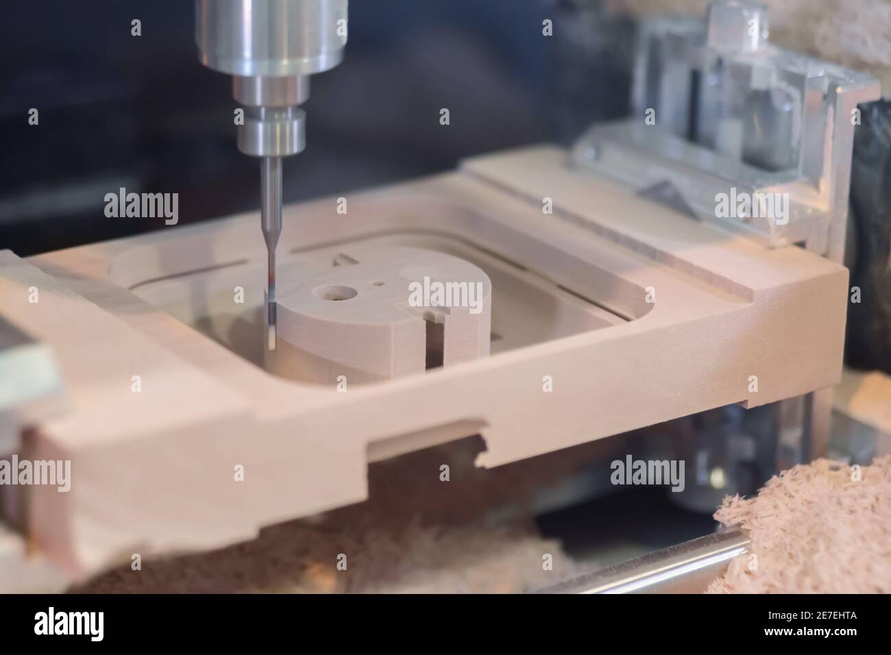 Milling machine cutting wooden workpiece from wood pulp at technology
