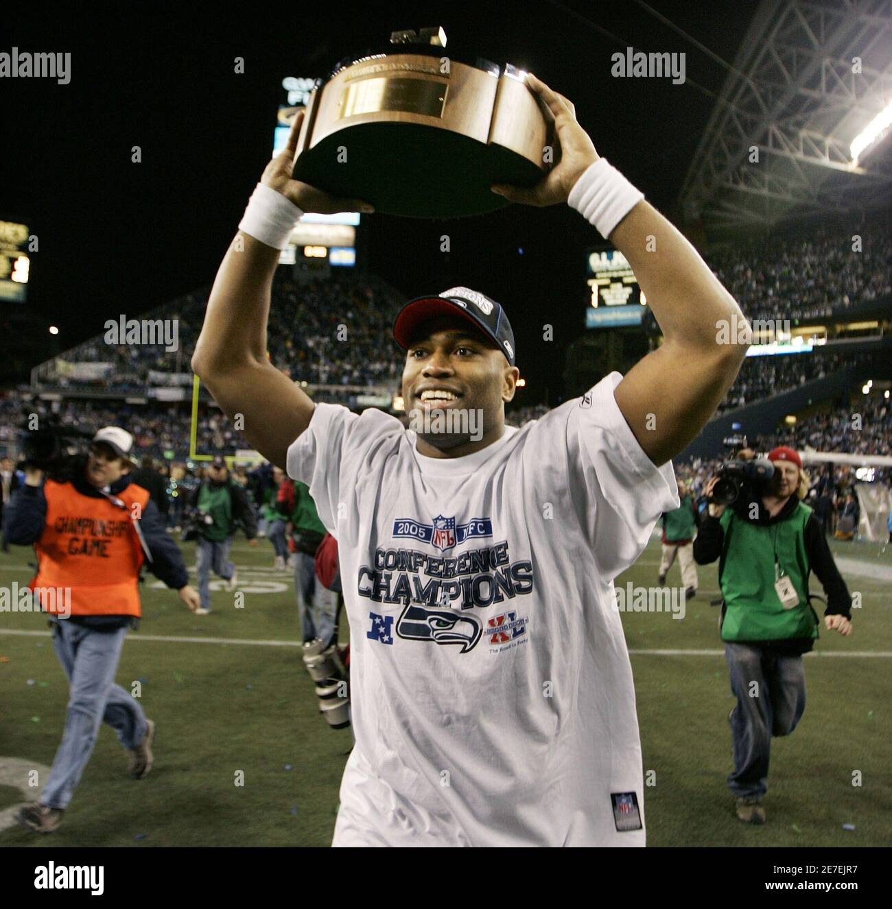 Seattle Seahawks Shaun Alexander holds up the George Halas Trophy after the  Seahawks defeated the Carolina Panthers in the NFL's NFC Championship game  in Seattle January 22, 2006. Seattle advance to Super
