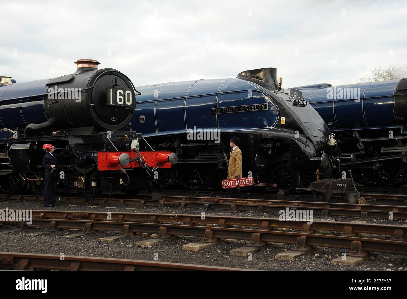 'King Edward II', 'Sir Nigel Gresley' and 'Tornado' with cleaner and shed foreman. Stock Photo