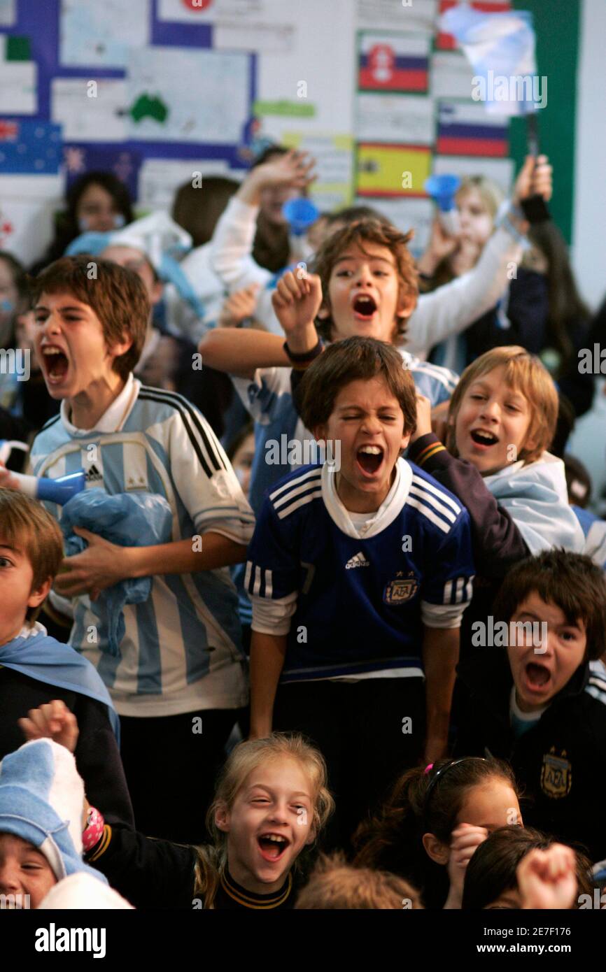 Students celebrate a goal by Argentina against South Korea in their World Cup soccer match, as they watch the match on television in their classroom at Jean Piaget Colegio in Buenos Aires June 17, 2010. Argentina's Education Minister Alberto Sileoni authorised all schools across the country to have a television in their classrooms to watch the World Cup matches. REUTERS/Martin Acosta (ARGENTINA - Tags: SPORT SOCCER WORLD CUP) Stock Photo