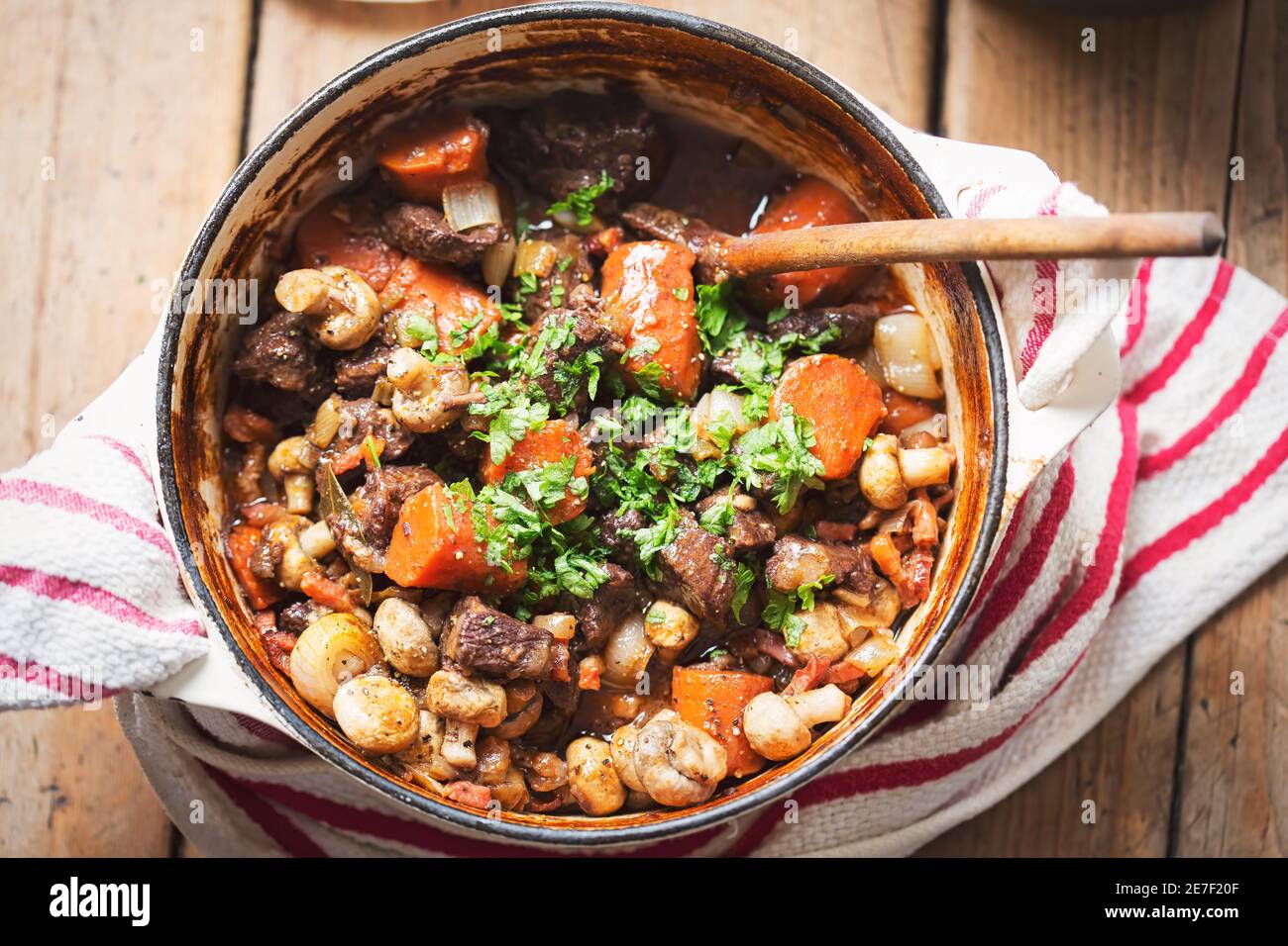 Boeuf bourguignon with carrots, mushrooms, topped with parsley Stock Photo