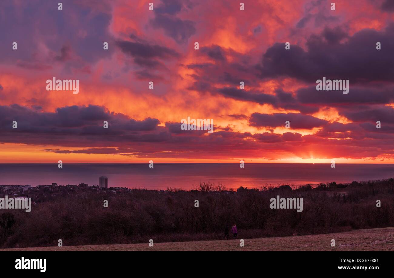 January sunrise over Eastbourne on the east Sussex coast from Warren Hill on the south downs south east England Stock Photo