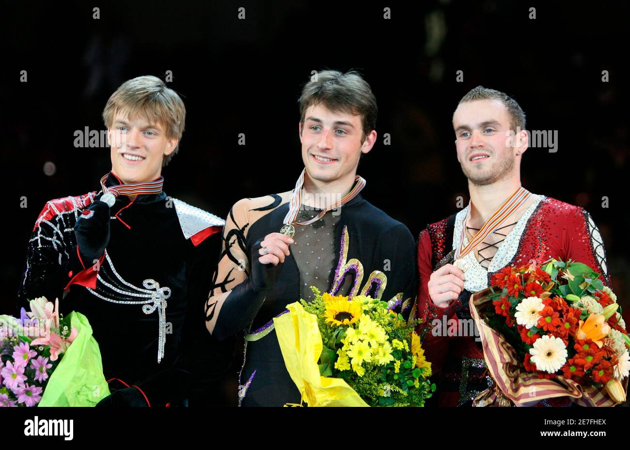 France S Brian Joubert Czech Republic S Tomas Verner L And Belgium S Kevin Van Der Perren R React During The Awards Ceremony After The Men S Free Programme Of The European Figure Skating Championships At