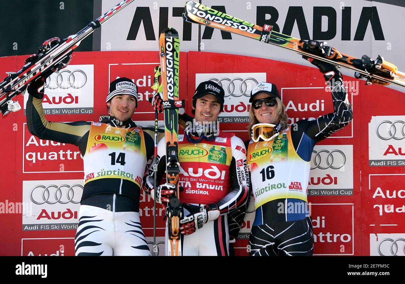 France's Jean-Baptiste Grange (C) celebrates with second classified Germany's Felix Neureuther (L) and Ted Ligety on the podium of the Val Badia Men's Slalom Ski World Cup in Val Badia December 17, 2007.     REUTERS/Alessandro Bianchi   (ITALY) Stock Photo